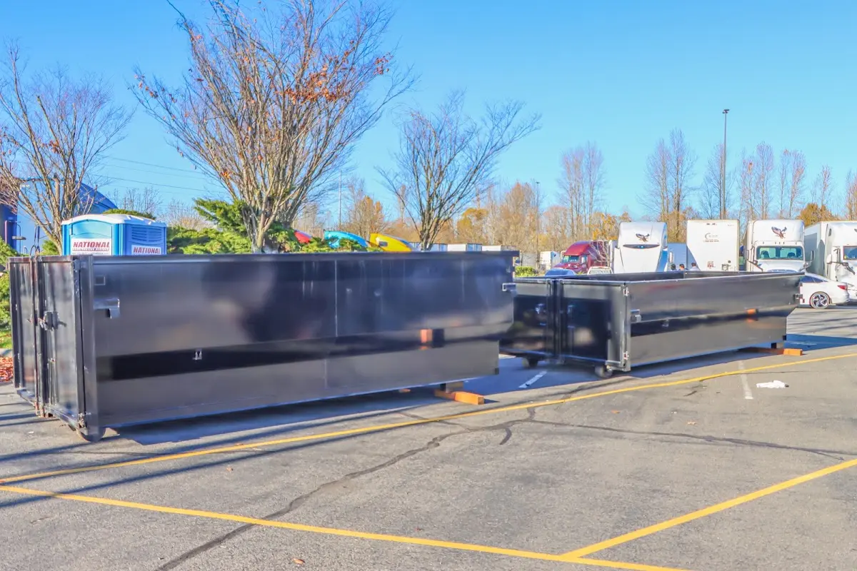 Professional dumpster rental service with roll-off container on residential driveway in Sahuarita